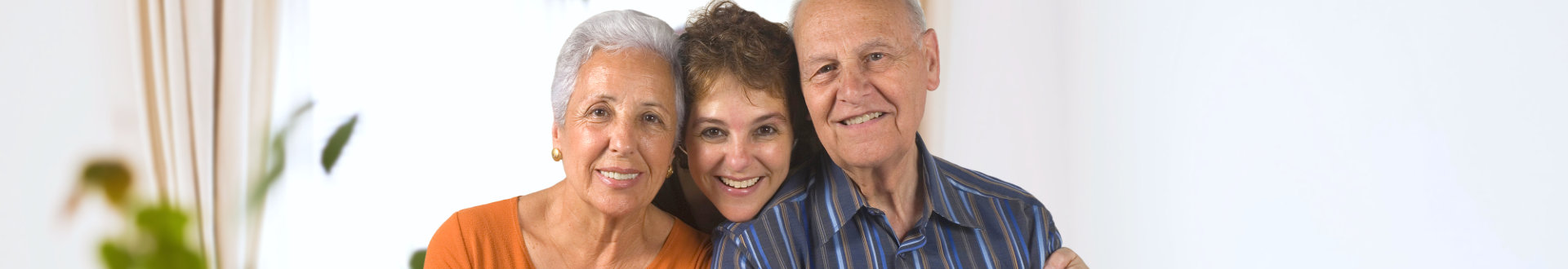 senior couple and their caregiver